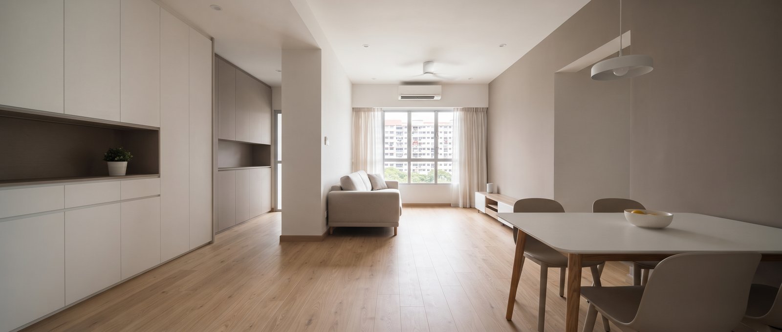 Completed Singapore home interior, wide view showing full living and dining layout